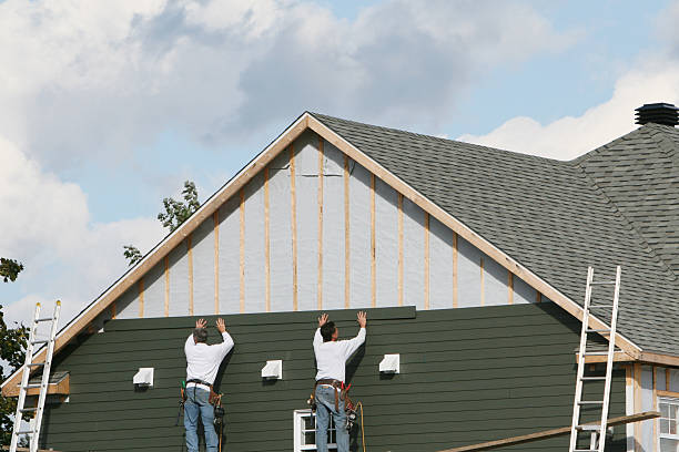 Professional Siding Contractor technician working in Ridgeway, VA